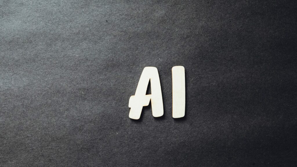 Grey background with AI written in large white letters in the centre of the image